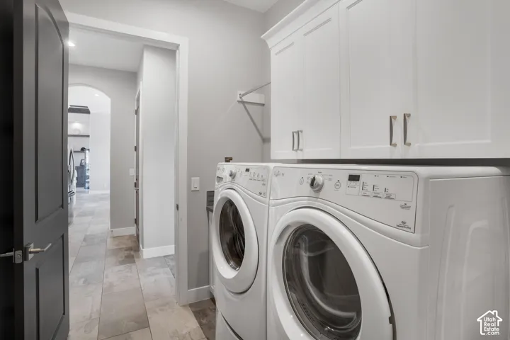 White shaker-style cabinetry with brushed nickel hardware