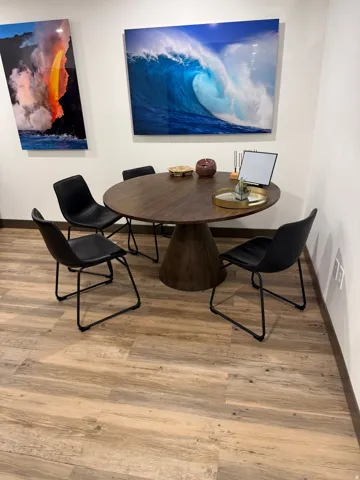Wood-finish flooring with a neutral tone. Break room. Pictures from the previous tenant. The office is now vacant
