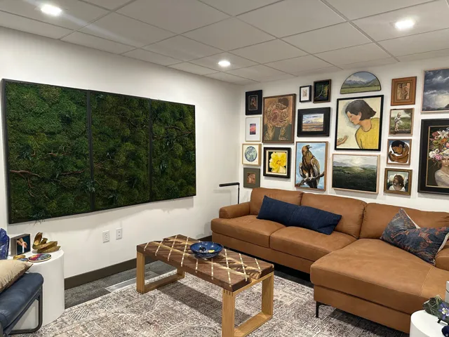 Recessed ceiling lighting illuminates the space, featuring white walls, dark trim, and carpeting. Pictures from the previous tenant. The office is now vacant