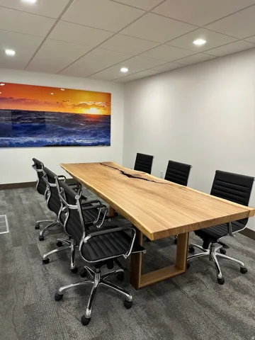 White walls with recessed lighting, suspended ceiling, and gray carpet flooring. Pictures from the previous tenant. Office is now vacant