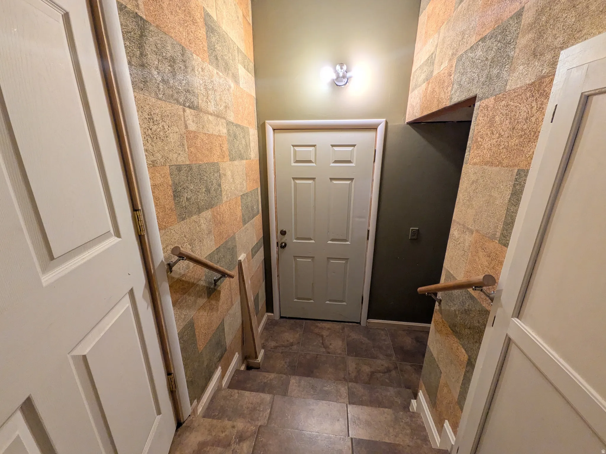 Back yard entrance and to the garage on right of door.