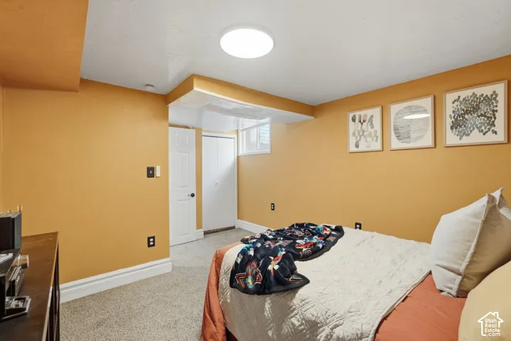 Bedroom #3 Recessed lighting, light-colored carpeting, white trim, and a white interior door