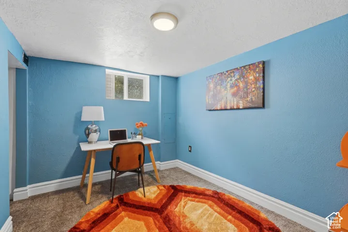Bedroom #4 Carpeted flooring with white trim, light blue walls, and a recessed window