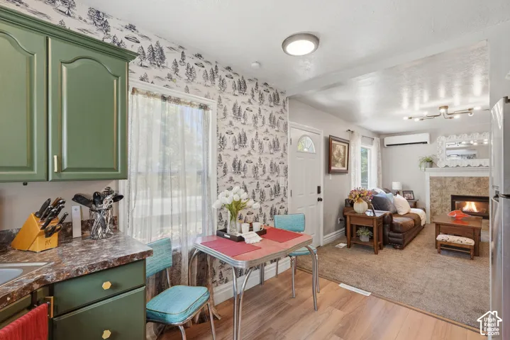 Kitchen area featuring green cabinetry and a laminate countertop