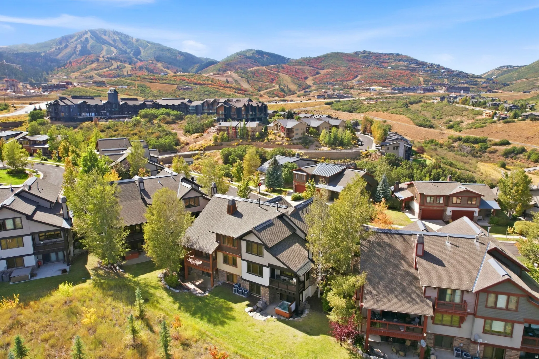 Mountainous landscape with expansive residential properties and varied rooflines