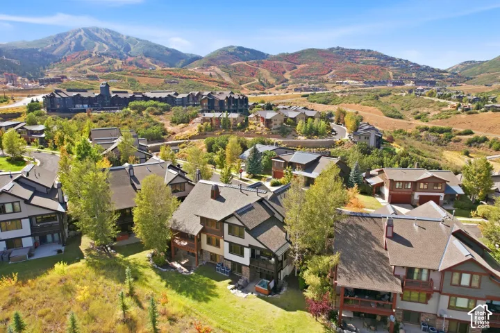 Mountainous landscape with expansive residential properties and varied rooflines
