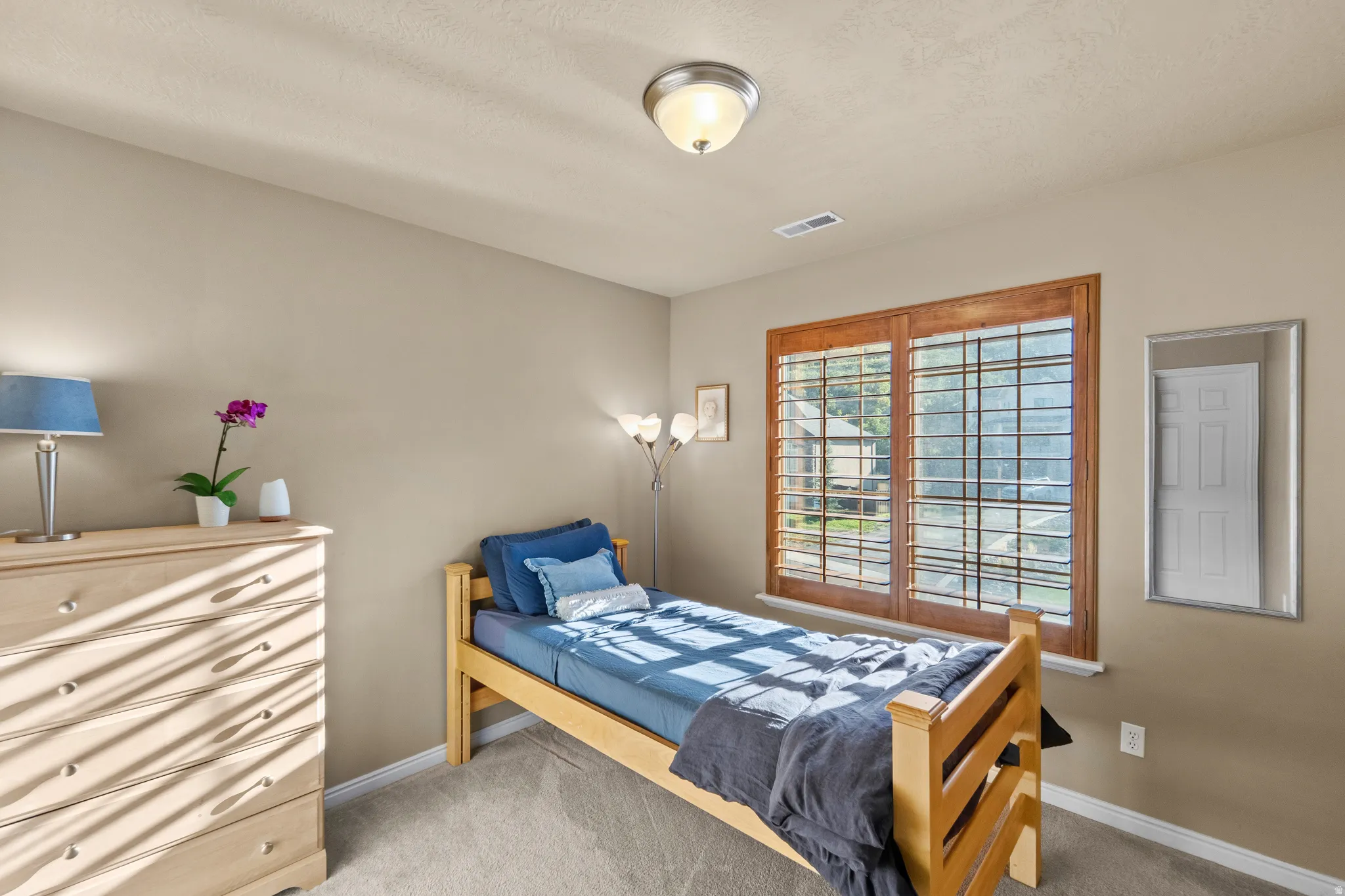 Bedroom 2 Wall-to-wall carpeting and neutral wall tones