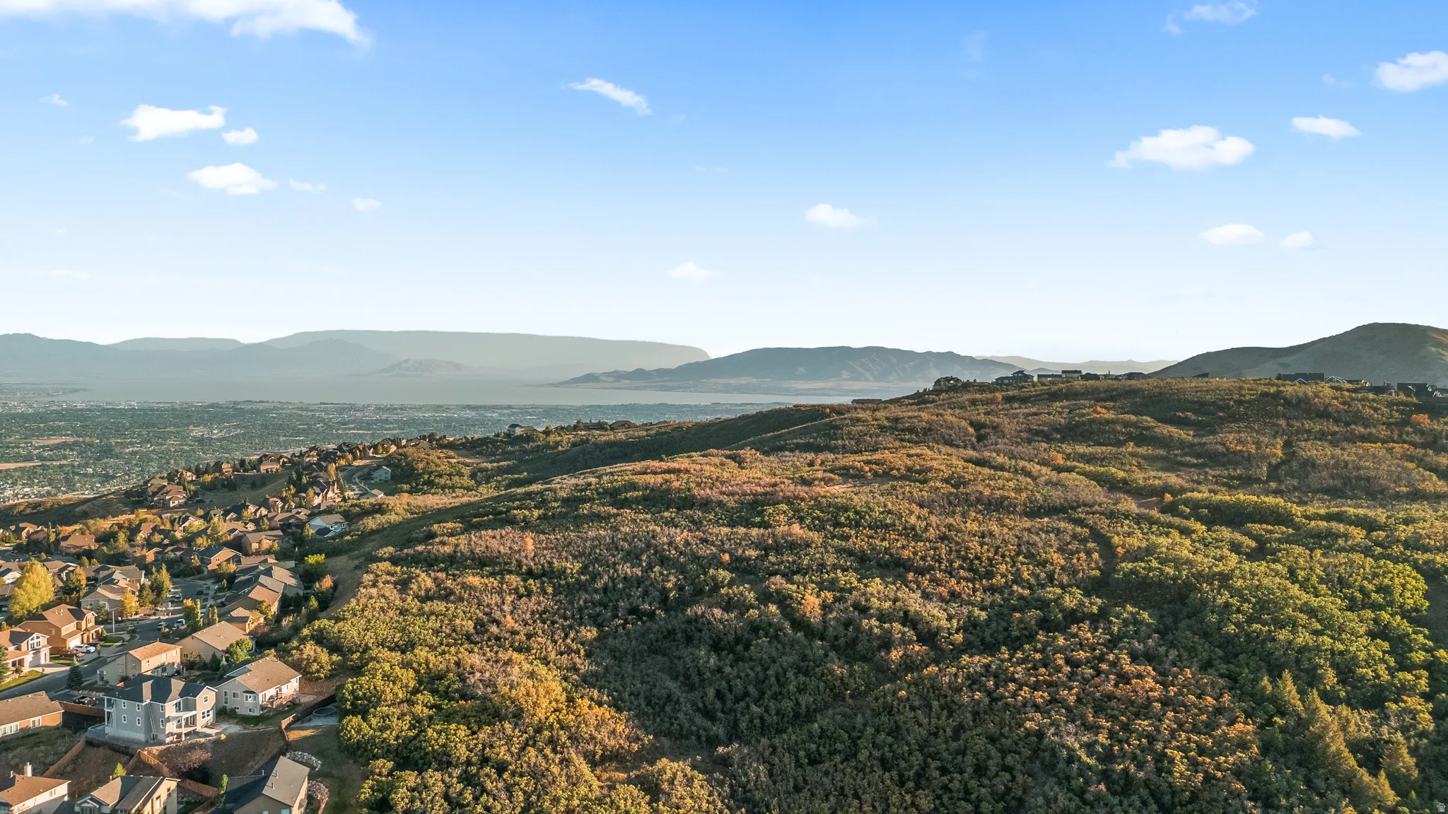 Expansive mountain landscape with scattered residential properties
