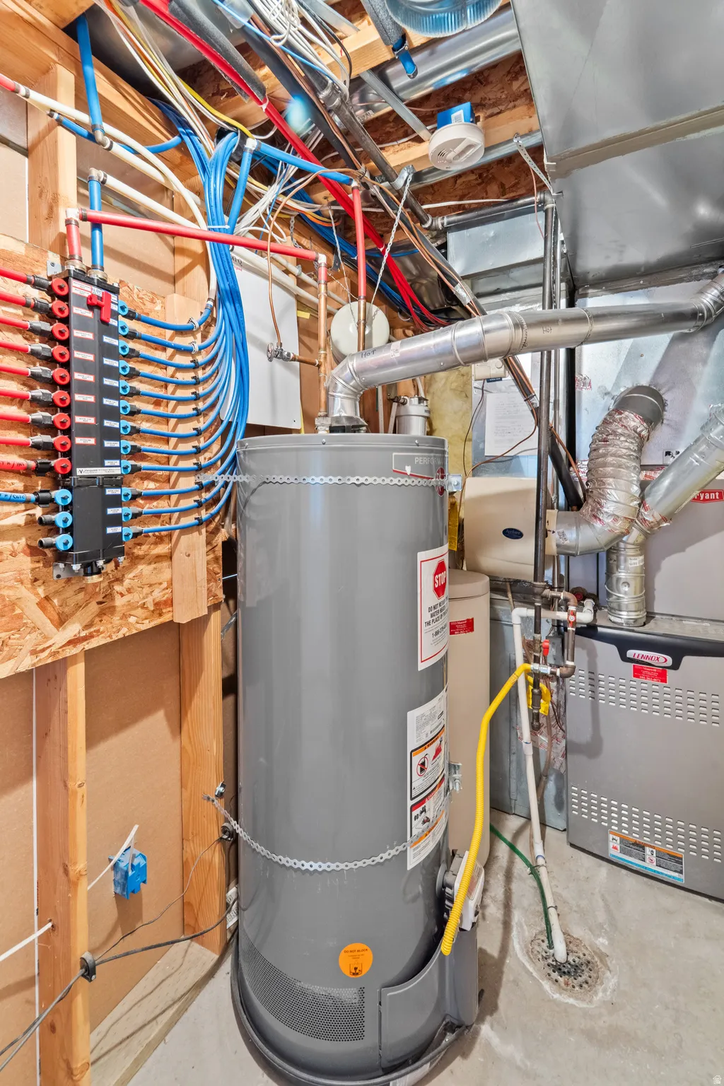 Water heater unit with PEX plumbing system