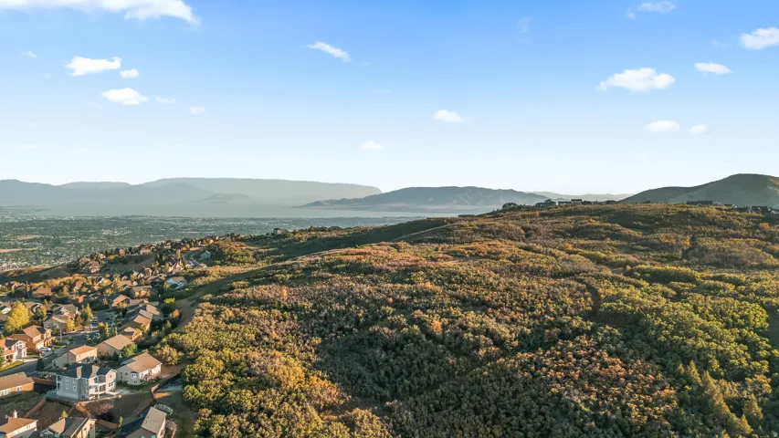Expansive mountain landscape with scattered residential properties