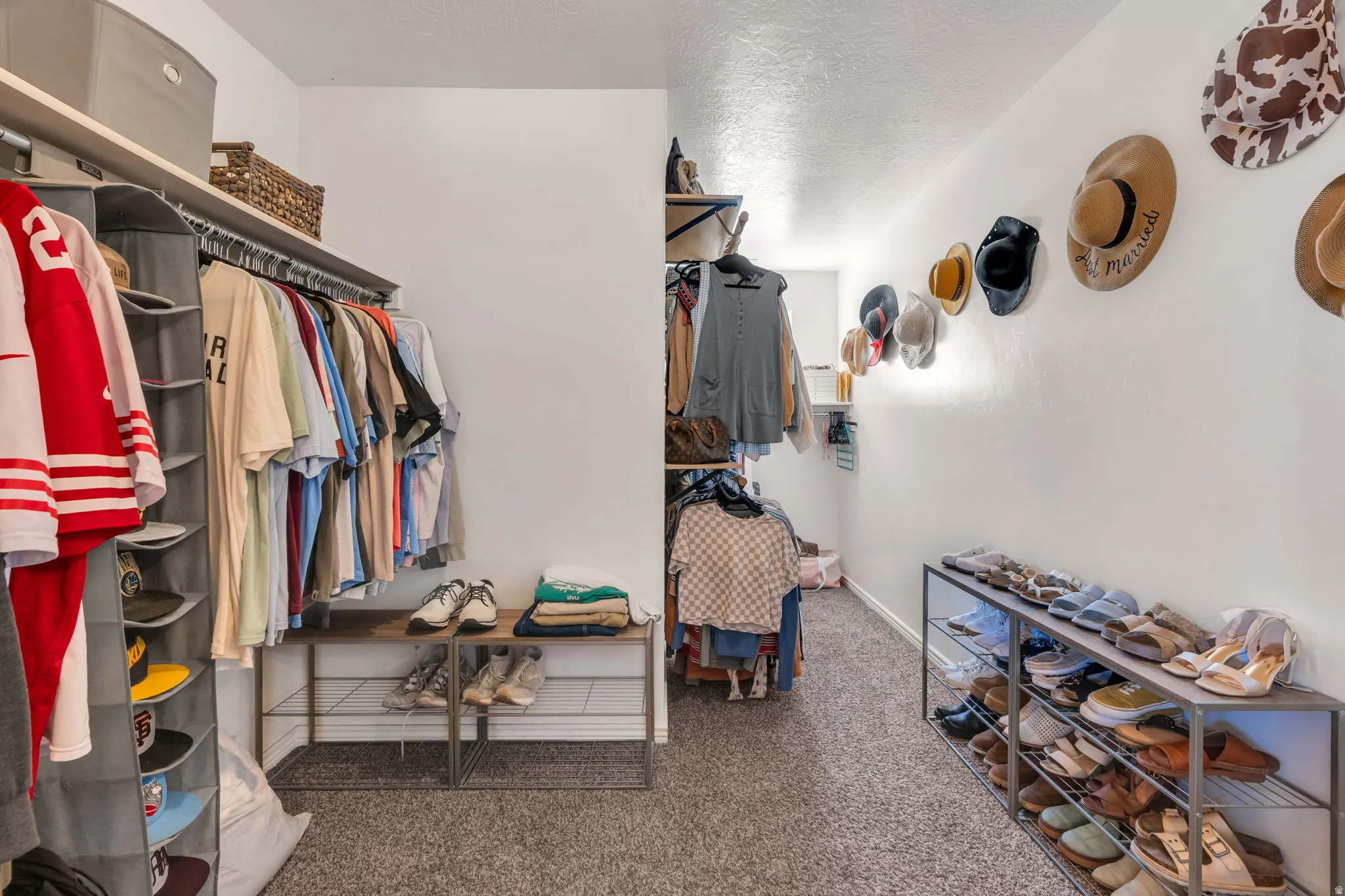 Built-in closet organization system with hanging rods and shelving