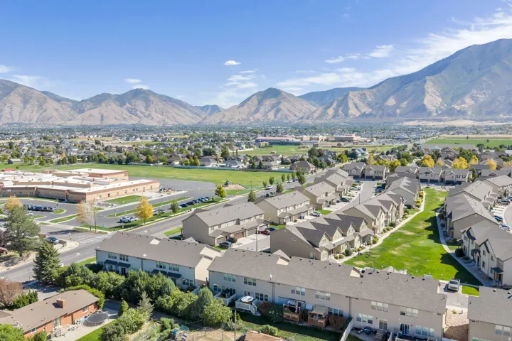Mountain backdrop with expansive residential area featuring multiple housing units