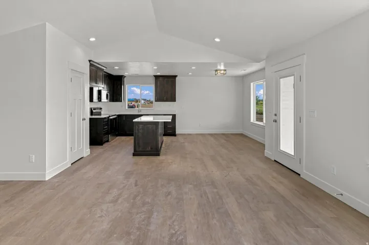 Vaulted ceilings complement the wood-finish flooring