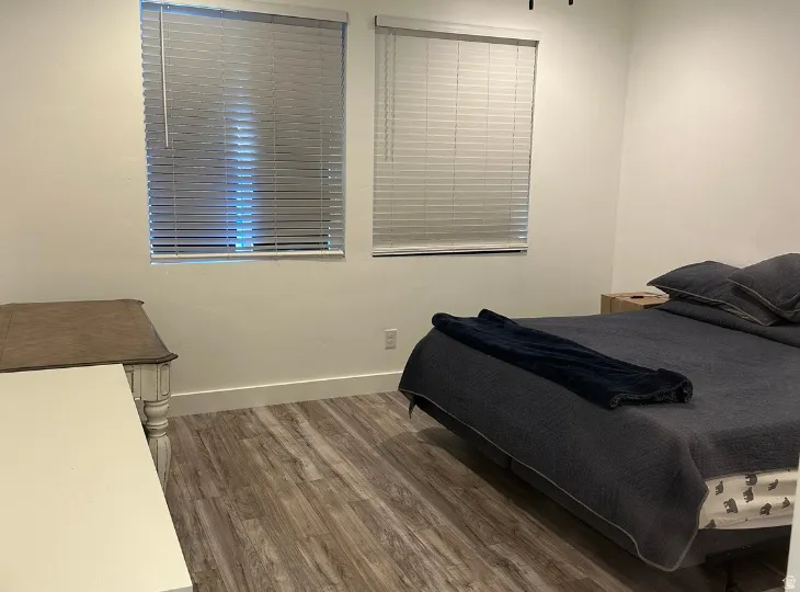 Wood-finish flooring throughout, complemented by white walls