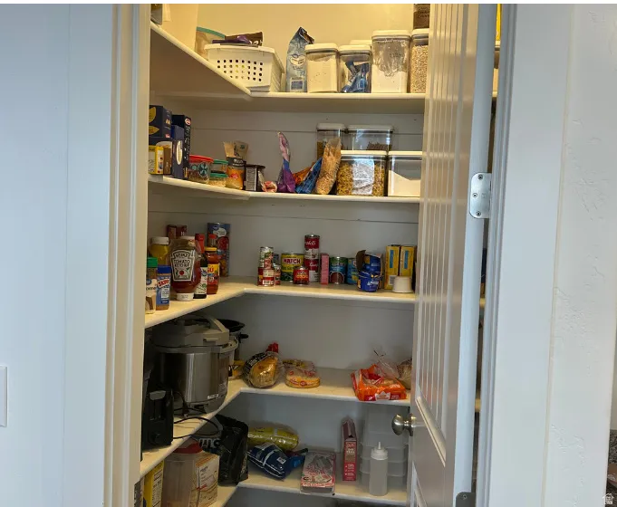 Corner pantry with extensive built-in shelving