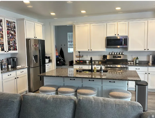 White shaker cabinetry and recessed lighting