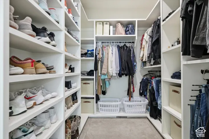 Built-in closet system with extensive shelving and hanging rods