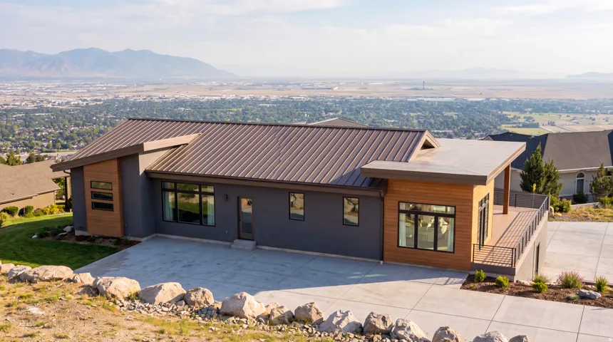 Modern architectural design with a metal roof and wood-finish siding accents