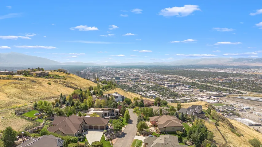 Expansive city backdrop with distant mountain ranges