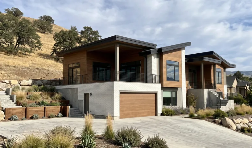 Contemporary exterior with wood-finish siding, white brick accents, and a sloped roofline