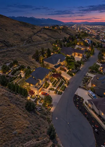 Hillside residence with extensive terraced landscaping and integrated exterior lighting