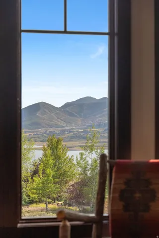 Window framing expansive mountain and water scenery