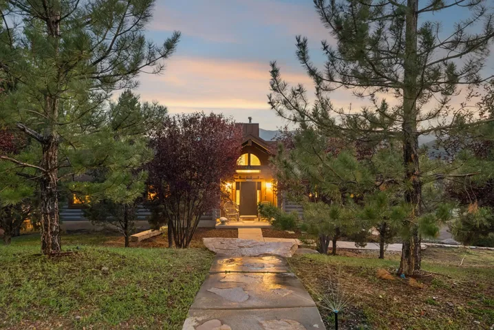 Stone walkway leading to a prominent arched entry