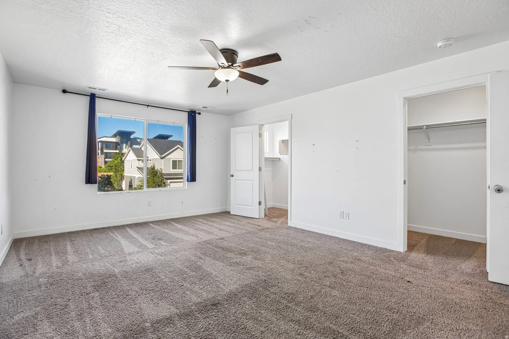 Primary bedroom with double closet and primary suite