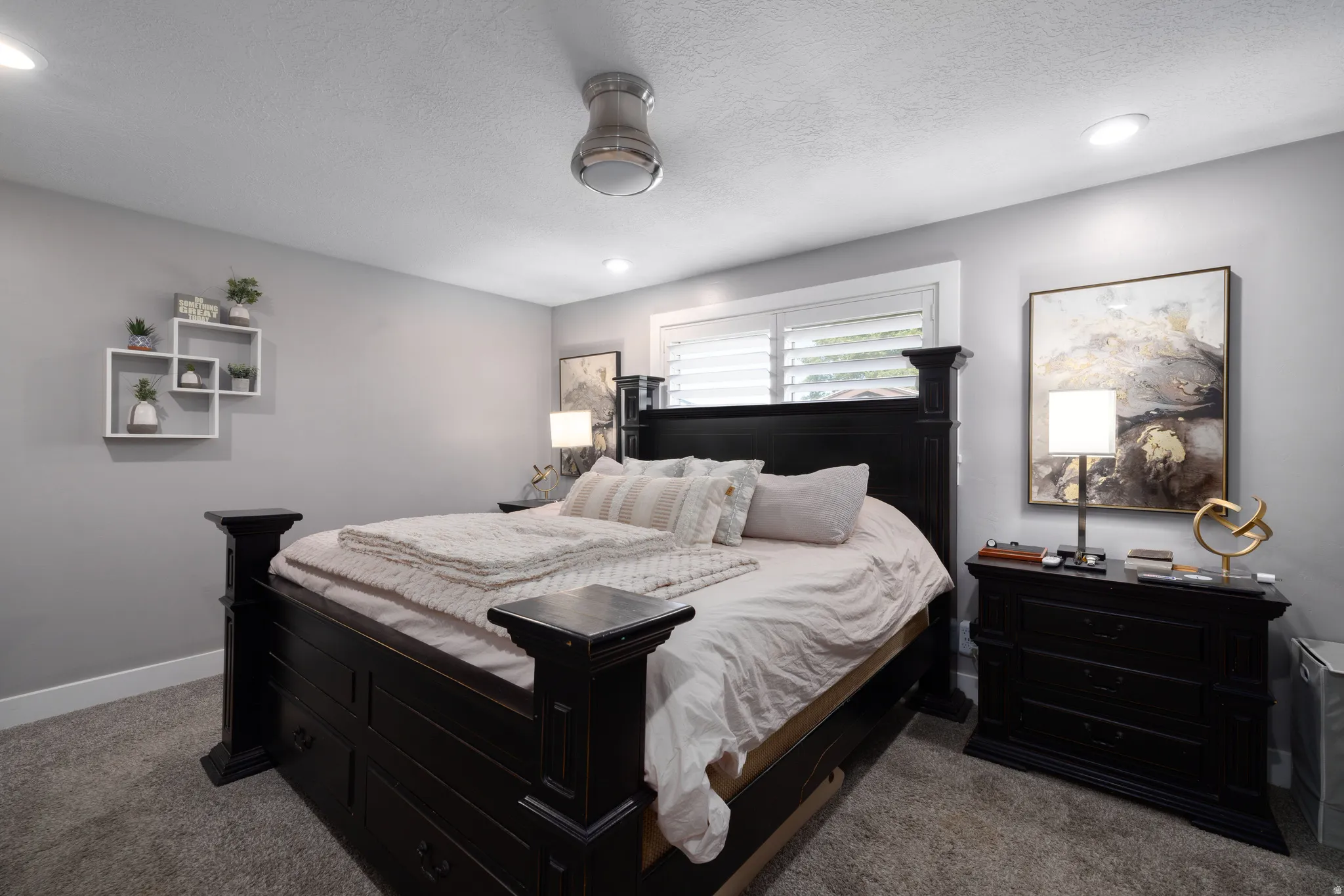 Recessed lighting, ceiling fan, window with plantation shutters, and light gray wall paint