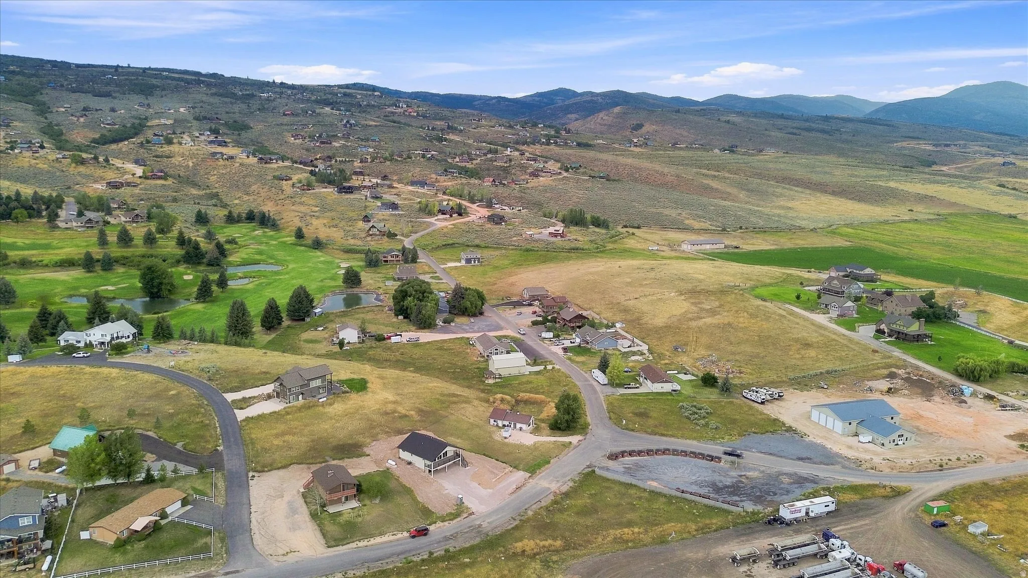 Expansive rural setting with rolling hills and distant mountains