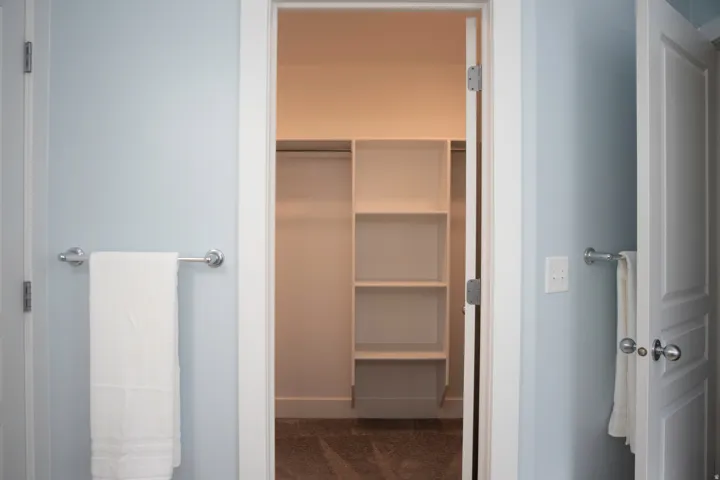 Recessed closet with integrated shelving and hanging rods