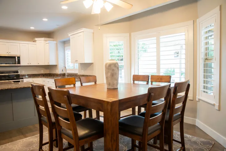 Integrated dining area and kitchen with wood-finish flooring