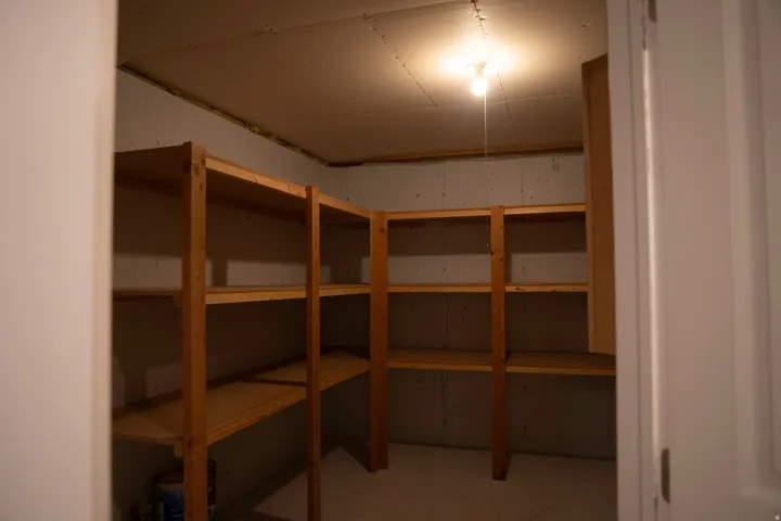Built-in wood shelving units provide extensive storage