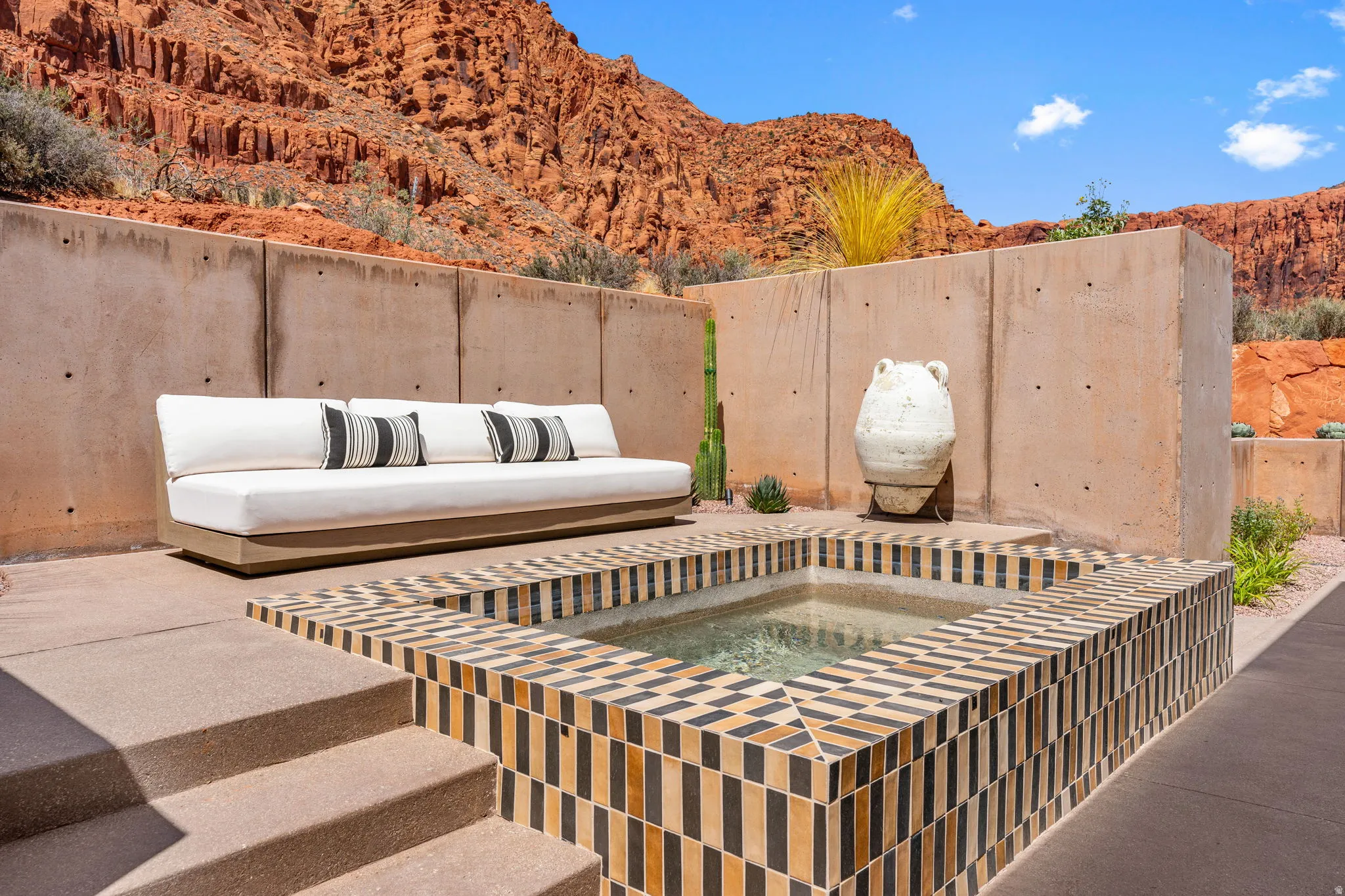 Sunken tiled spa with geometric pattern