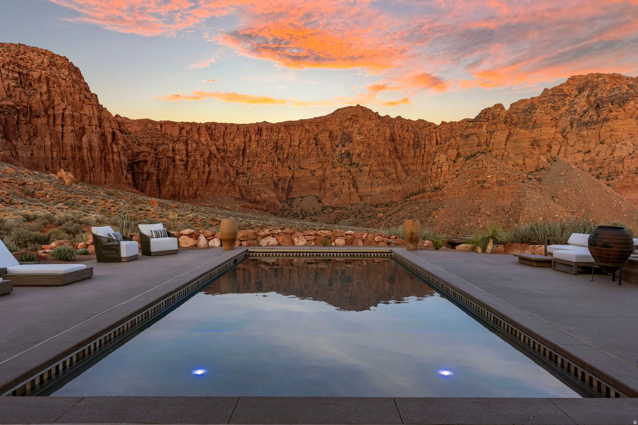 Rectangular pool with integrated lighting, surrounded by concrete decking