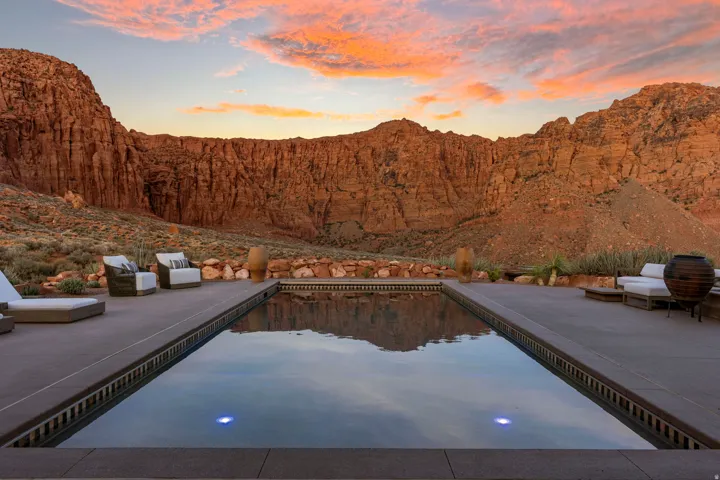 Rectangular pool with integrated lighting, surrounded by concrete decking