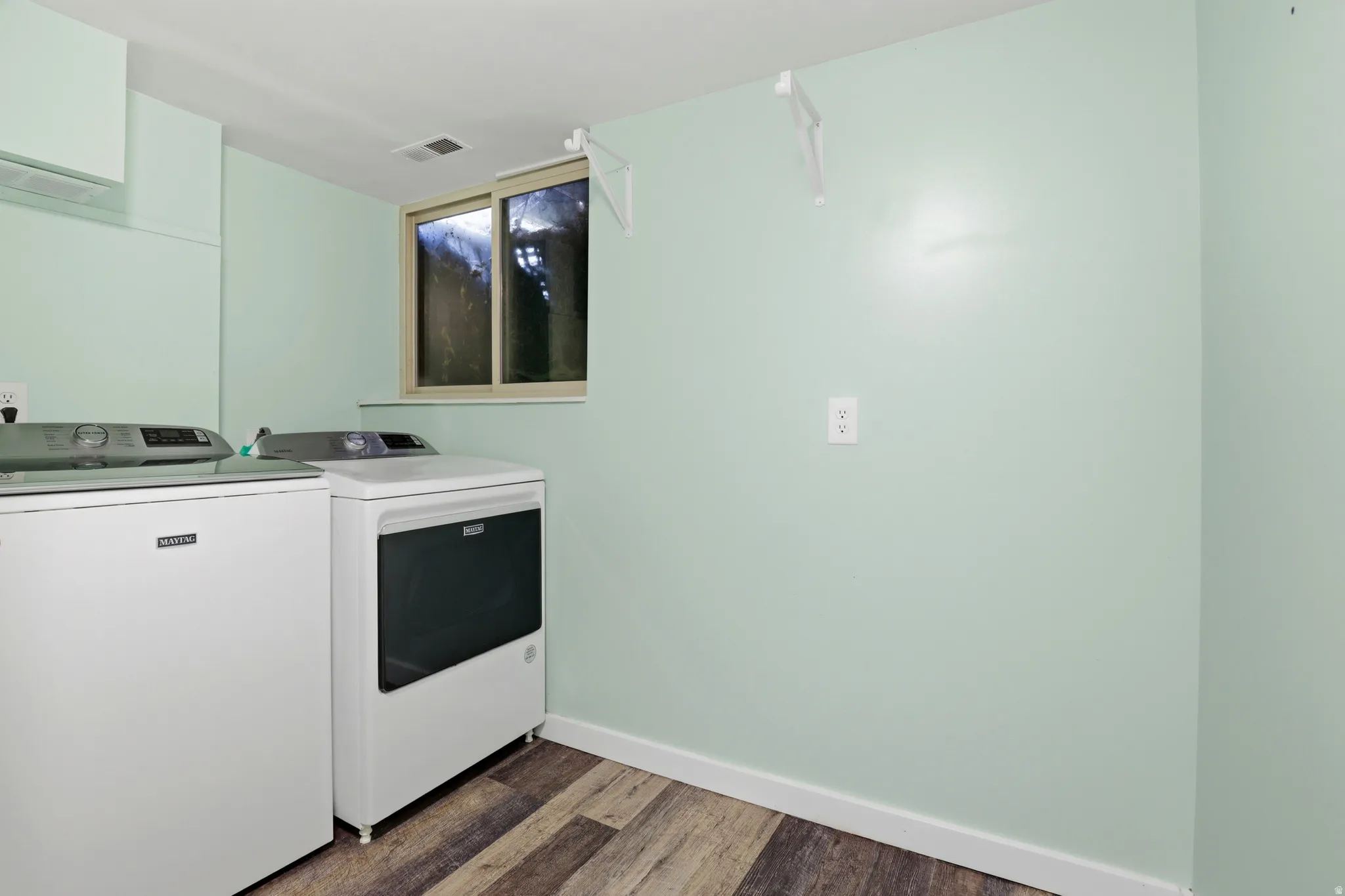 Wood-finish flooring with light green walls