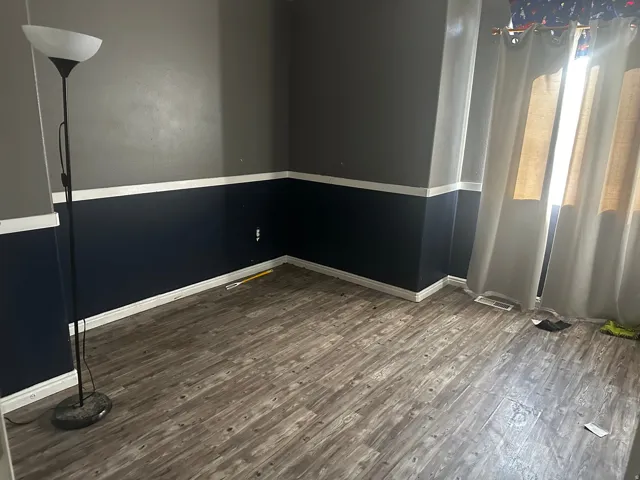 Wood-finish flooring with baseboard trim