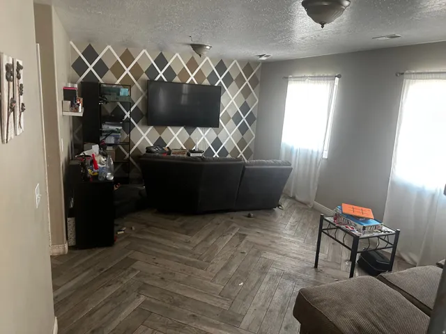 Wood-finish flooring arranged in a herringbone pattern
