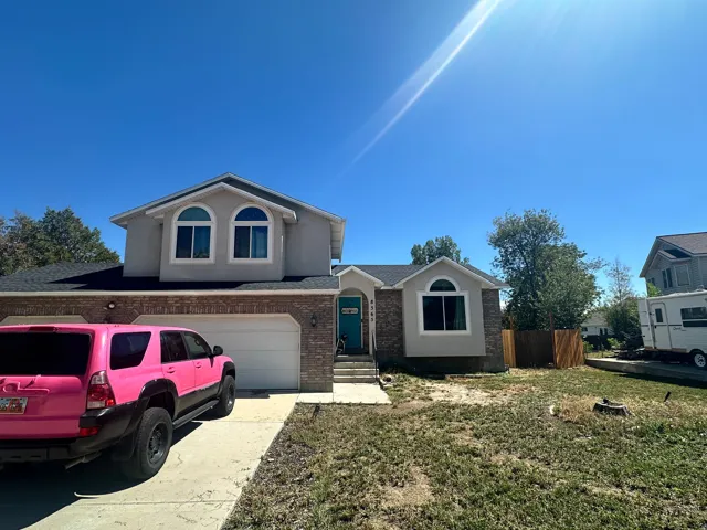 Brick and stucco exterior with a two-car garage