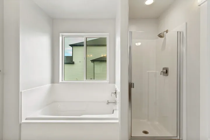 White built-in bathtub with deck-mounted faucet