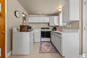 White cabinetry and light-toned walls