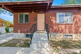 Brick exterior with a covered entry