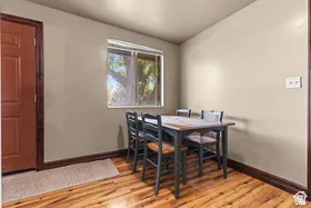 Wood-finish flooring with a contrasting dark baseboard