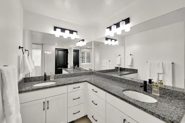 Dual undermount sinks set into a granite countertop