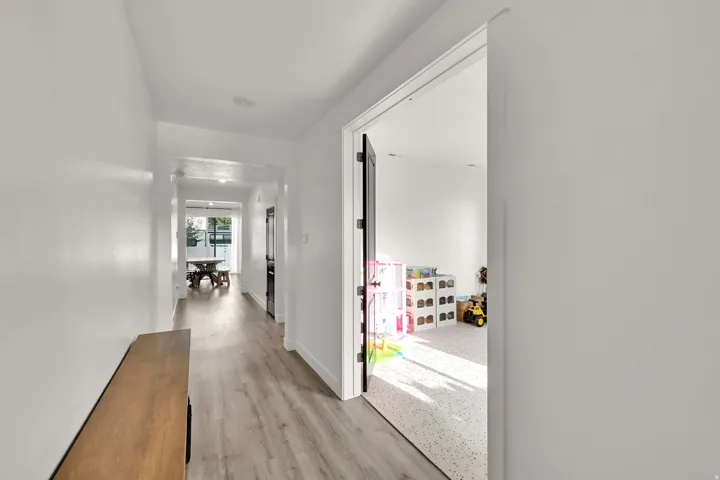 Hallway featuring wood-finish flooring and recessed lighting