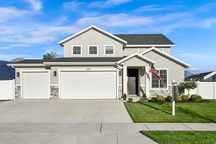 Contemporary stucco exterior with stone accents