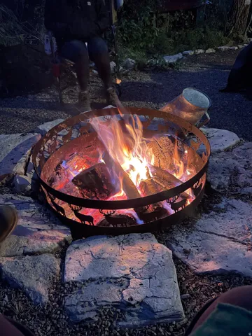 Stone paver patio featuring a decorative fire pit
