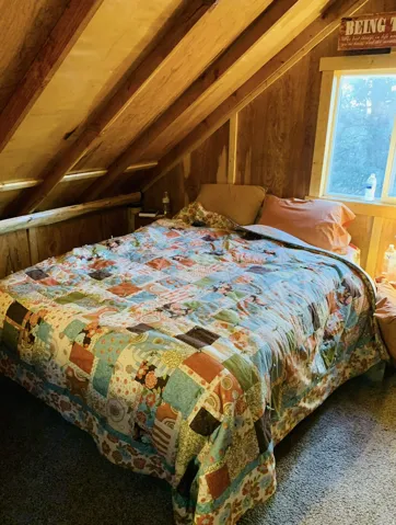 Wood-paneled walls and ceiling with exposed beams