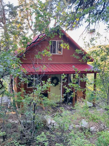 Red-toned exterior with a metal roof